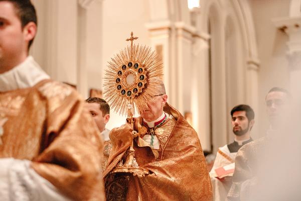 How should we prepare to receive Christ in the Eucharist?
